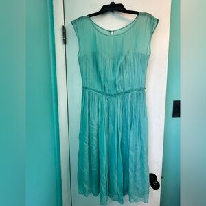 Super pretty turquoise chiffon tea length dress. Size 6L